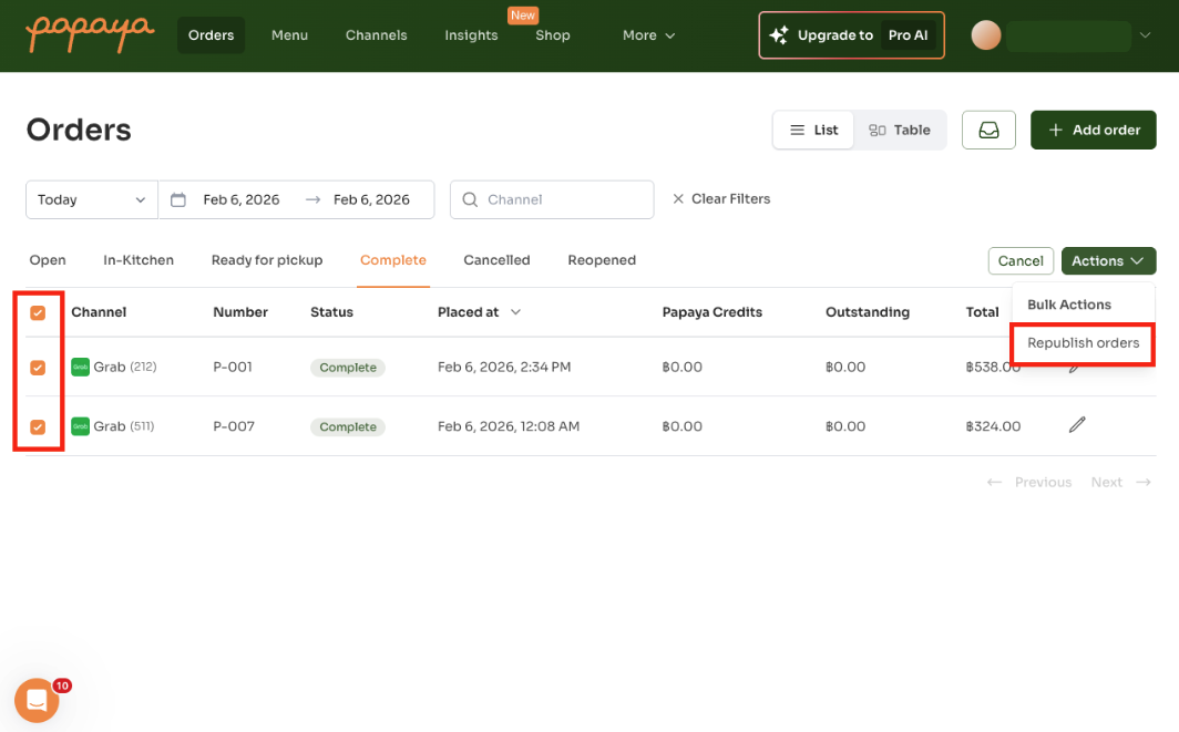Papaya dashboard Orders page showing two completed orders selected via checkboxes, with the Actions dropdown menu open displaying the 